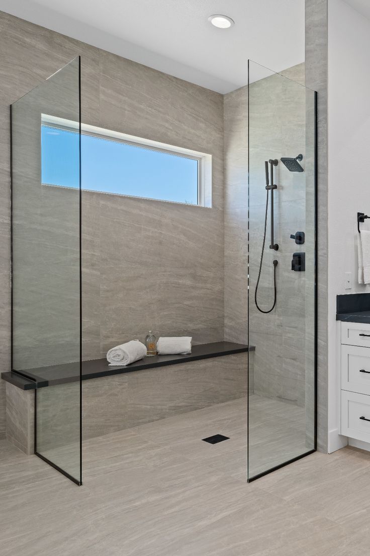 Curbless walk-in shower with bench seating designed for aging-in-place bathroom safety