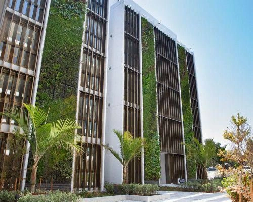 Eco-Brutalist Exterior with Living Walls
